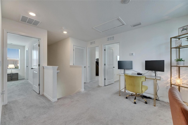 office area with carpet and visible vents