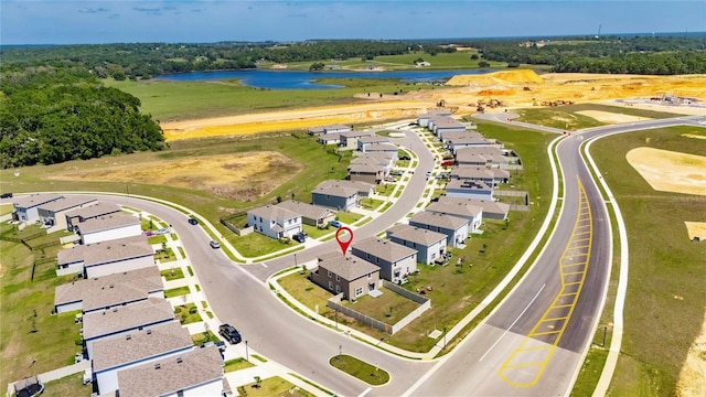 bird's eye view with a water view and a residential view