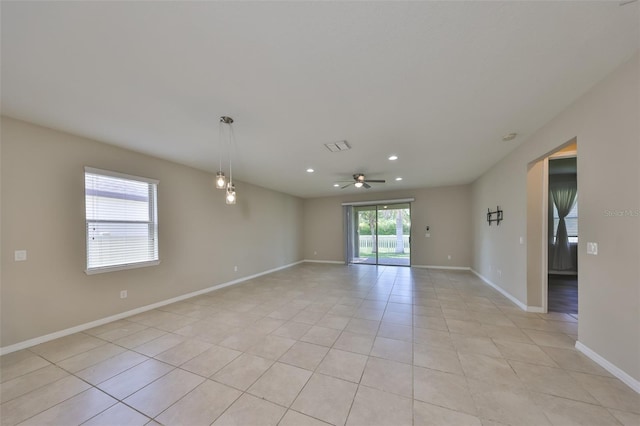 unfurnished room with baseboards, recessed lighting, ceiling fan, and light tile patterned floors