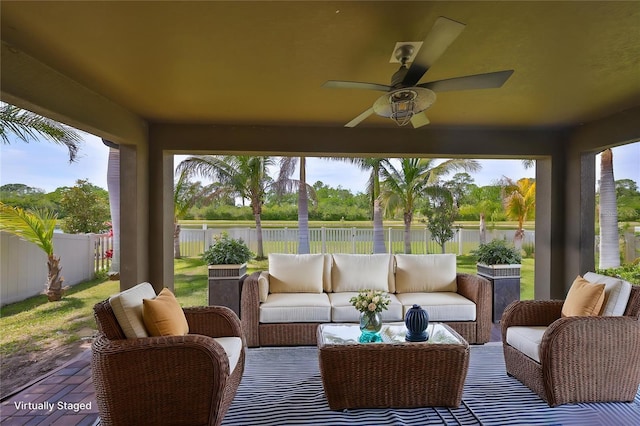 sunroom with a water view and a healthy amount of sunlight