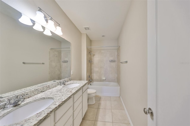 bathroom with toilet, tile patterned floors, visible vents, and a sink