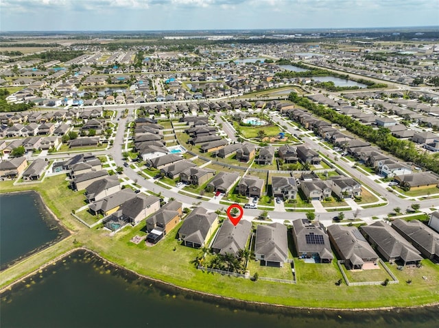 bird's eye view featuring a residential view and a water view
