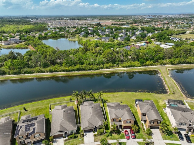 bird's eye view featuring a water view and a residential view