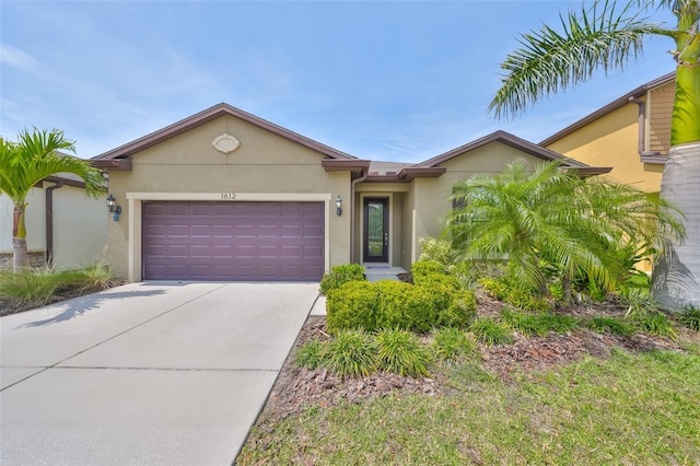 1612 Cabbage Key Dr, Ruskin, FL 33570 - view of front of property with stucco siding, driveway, and an attached garage