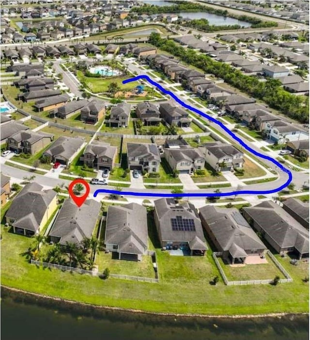 1612 Cabbage Key Dr, Ruskin, FL 33570 - aerial perspective of suburban area with a large body of water and a pool area