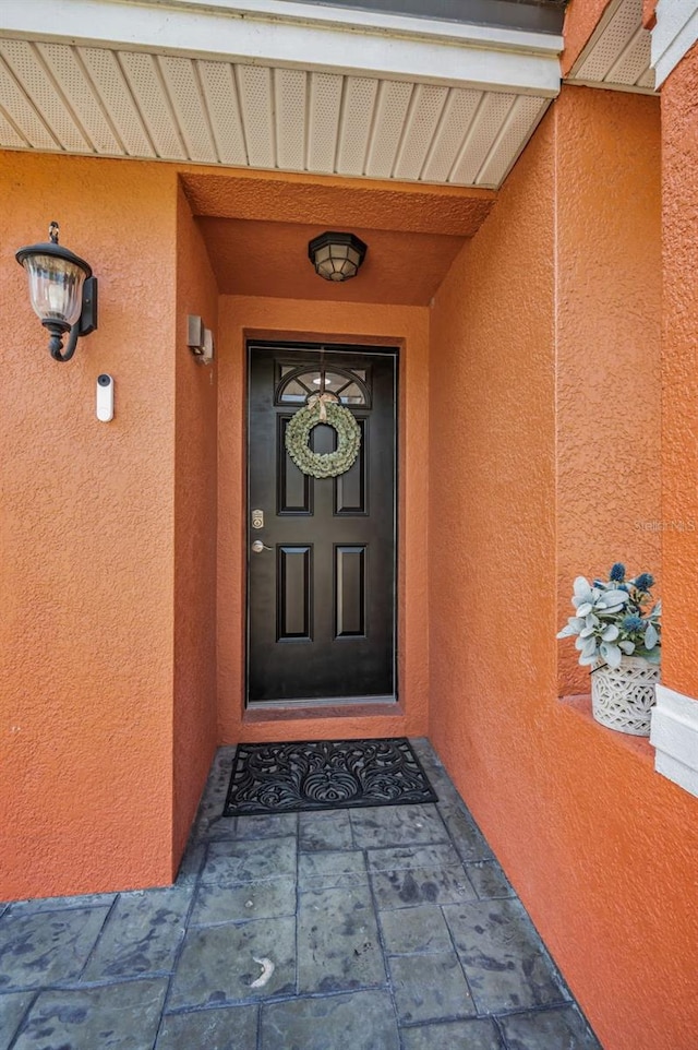 47 W Morgan St, Tarpon Springs, FL 34689 - view of exterior entry with stucco siding