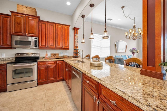 47 W Morgan St, Tarpon Springs, FL 34689 - kitchen featuring a sink, appliances with stainless steel finishes, light tile patterned floors, and light stone counters
