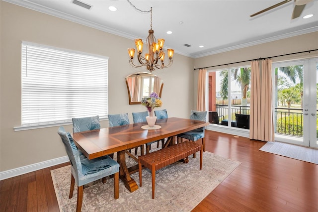 47 W Morgan St, Tarpon Springs, FL 34689 - dining area with crown molding, recessed lighting, baseboards, wood finished floors, and visible vents