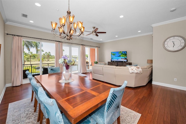 47 W Morgan St, Tarpon Springs, FL 34689 - dining area featuring baseboards, visible vents, wood finished floors, and ceiling fan with notable chandelier