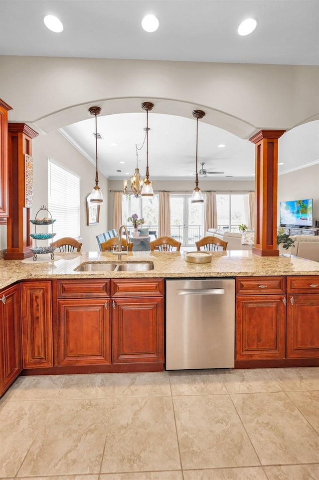 47 W Morgan St, Tarpon Springs, FL 34689 - kitchen with a sink, light stone counters, hanging light fixtures, and dishwasher