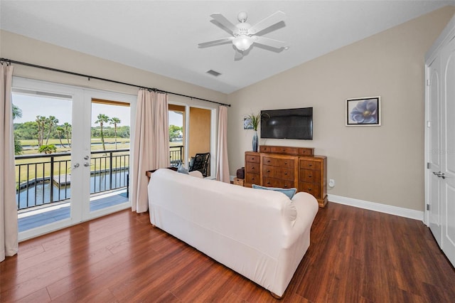 47 W Morgan St, Tarpon Springs, FL 34689 - living room featuring visible vents, baseboards, dark wood-type flooring, french doors, and vaulted ceiling