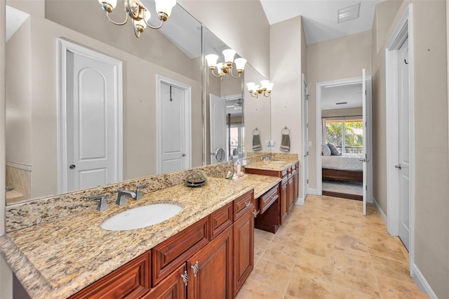 47 W Morgan St, Tarpon Springs, FL 34689 - bathroom with a sink, ensuite bathroom, double vanity, and a notable chandelier