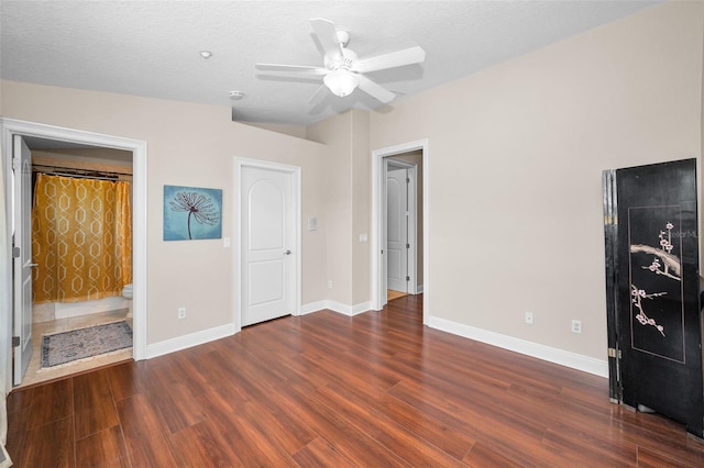 47 W Morgan St, Tarpon Springs, FL 34689 - unfurnished bedroom with baseboards, ensuite bathroom, a ceiling fan, and wood finished floors