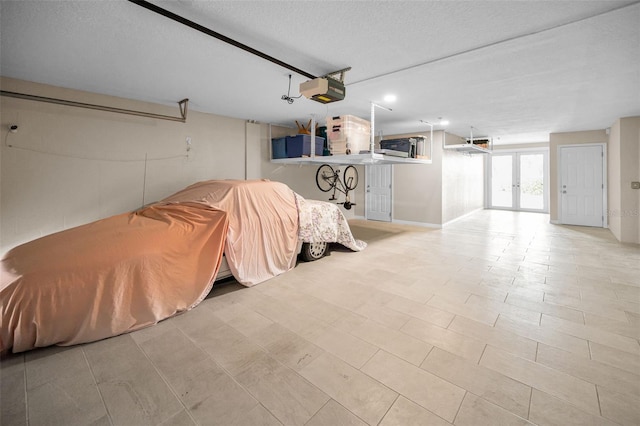 47 W Morgan St, Tarpon Springs, FL 34689 - garage featuring recessed lighting, french doors, and a garage door opener