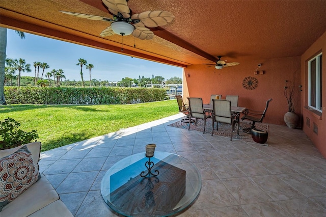 47 W Morgan St, Tarpon Springs, FL 34689 - view of patio / terrace with a ceiling fan and outdoor dining space