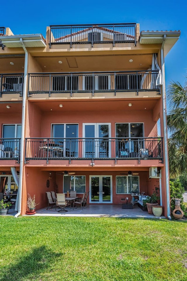 47 W Morgan St, Tarpon Springs, FL 34689 - back of house featuring a patio, a balcony, and stucco siding