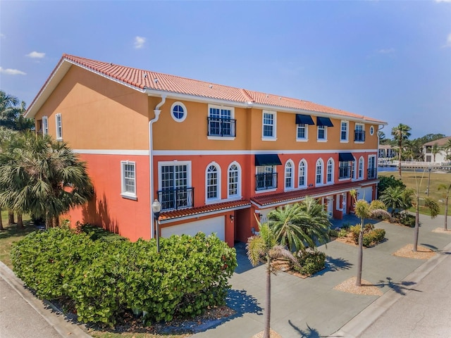 47 W Morgan St, Tarpon Springs, FL 34689 - view of property with an attached garage
