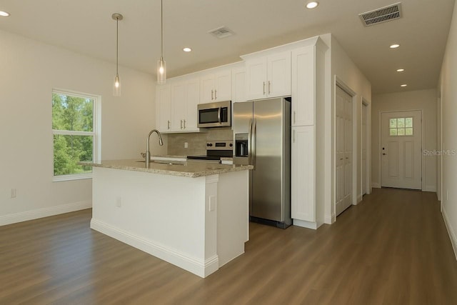 9002 Glenarm Way, Spring Hill, FL 34613 - kitchen featuring stainless steel appliances, a sink, dark wood-style flooring, recessed lighting, and white cabinetry
