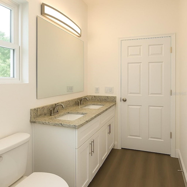 9002 Glenarm Way, Spring Hill, FL 34613 - bathroom with toilet, wood finished floors, and double vanity