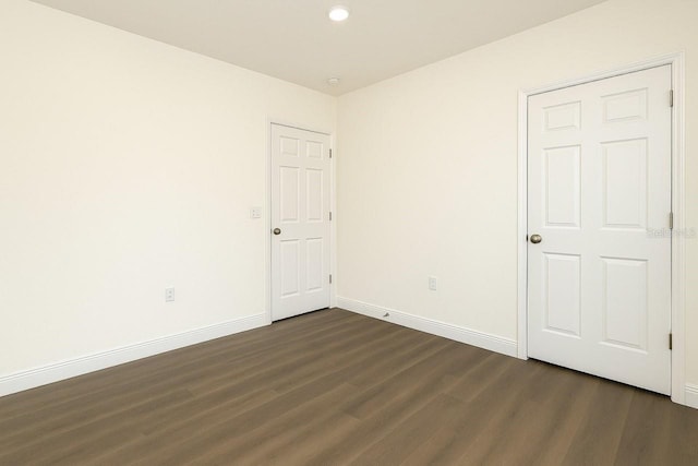 9002 Glenarm Way, Spring Hill, FL 34613 - unfurnished bedroom with dark wood finished floors, baseboards, and recessed lighting