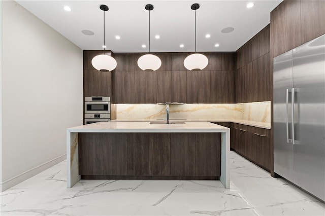 kitchen with stainless steel appliances, marble finish floor, a sink, modern cabinets, and dark brown cabinetry