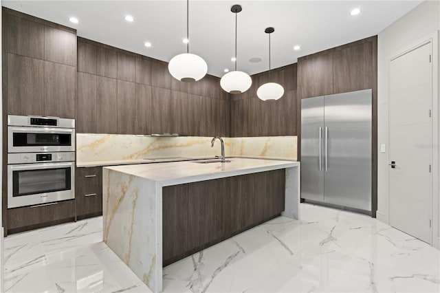 kitchen featuring marble finish floor, a sink, and modern cabinets