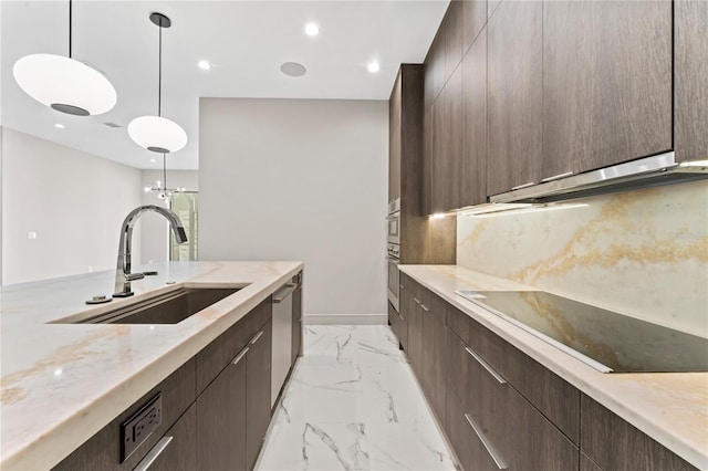 kitchen featuring marble finish floor, a sink, modern cabinets, and appliances with stainless steel finishes
