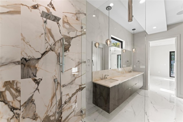 full bath featuring a sink, marble finish floor, stone wall, and a marble finish shower