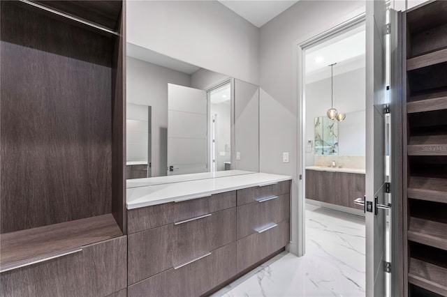 bathroom featuring marble finish floor, a sauna, and vanity