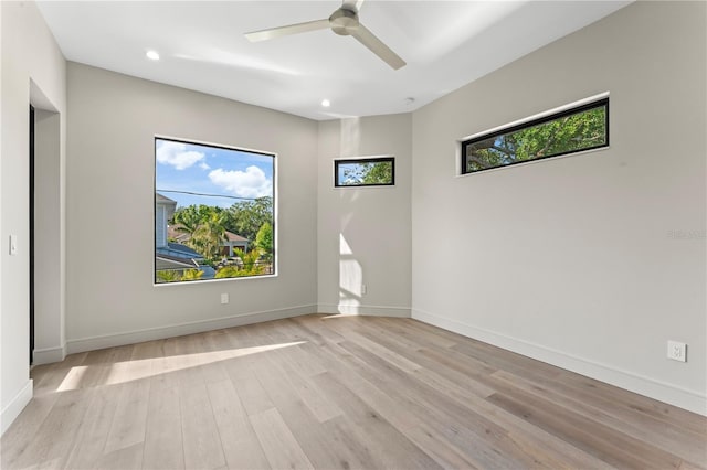 empty room with baseboards, recessed lighting, light wood-style floors, and a ceiling fan