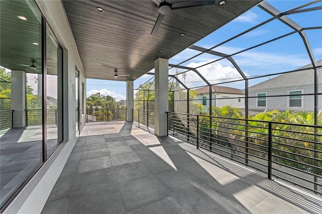 view of patio / terrace with a lanai and a ceiling fan