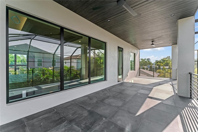 view of patio / terrace with a balcony and ceiling fan