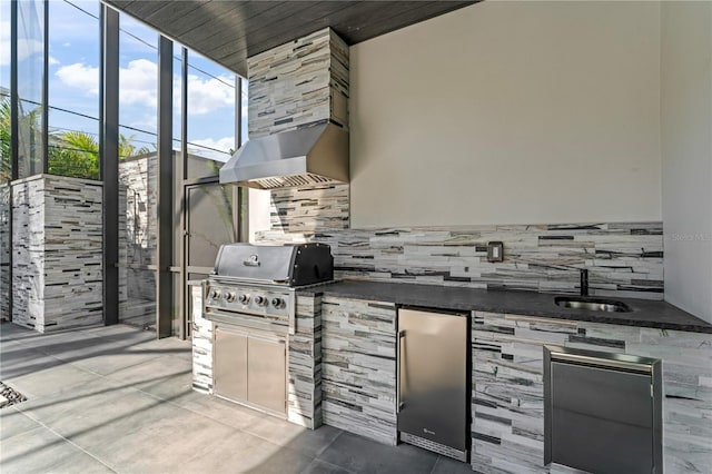 view of patio featuring a sink, an outdoor kitchen, and area for grilling