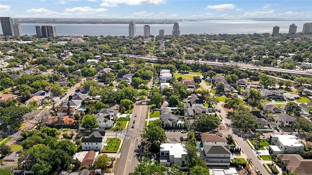 birds eye view of property featuring a residential view and a water view