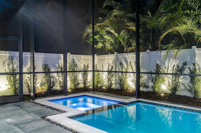 view of swimming pool featuring a fenced in pool, fence, a lanai, and a patio area