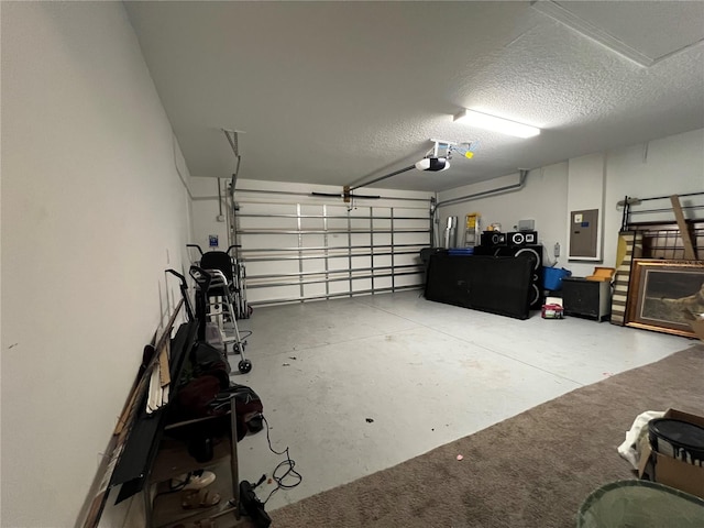 garage featuring a garage door opener and electric panel
