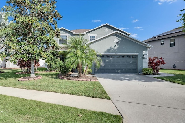 18734 Burndall Ct, Land O Lakes, FL 34638 - view of front of house with driveway, a front yard, and stucco siding