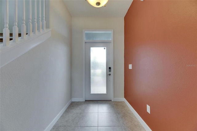 18734 Burndall Ct, Land O Lakes, FL 34638 - doorway featuring baseboards and light tile patterned floors