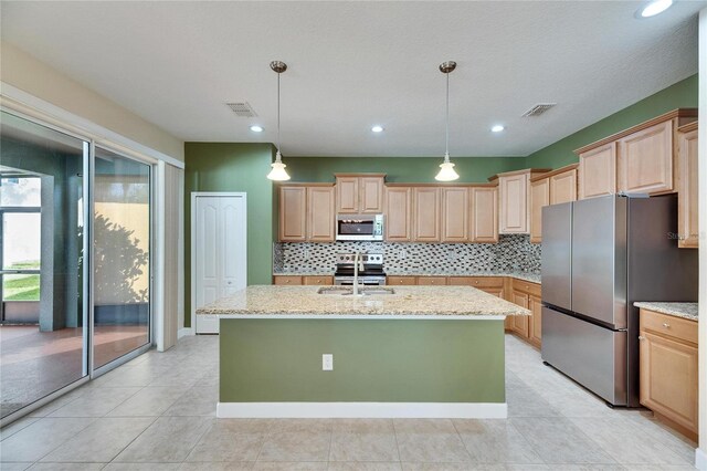 18734 Burndall Ct, Land O Lakes, FL 34638 - kitchen with stainless steel appliances, light brown cabinetry, and decorative backsplash
