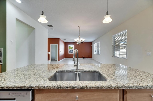 18734 Burndall Ct, Land O Lakes, FL 34638 - kitchen featuring light stone counters, a sink, open floor plan, visible vents, and dishwashing machine