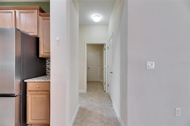 18734 Burndall Ct, Land O Lakes, FL 34638 - hall with baseboards and light tile patterned floors