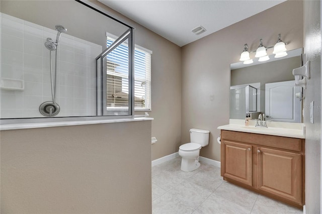 18734 Burndall Ct, Land O Lakes, FL 34638 - bathroom with tile patterned floors, toilet, a tile shower, visible vents, and vanity
