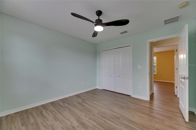 18734 Burndall Ct, Land O Lakes, FL 34638 - unfurnished bedroom with visible vents, light wood finished floors, and baseboards