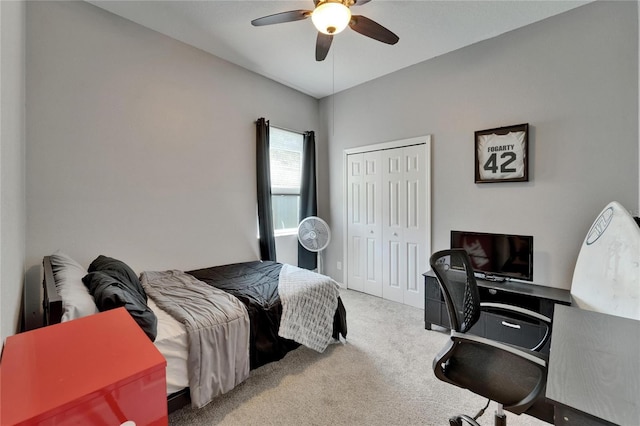 bedroom featuring a closet, a ceiling fan, and carpet flooring