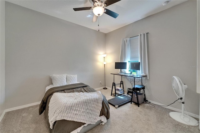 bedroom featuring baseboards, a ceiling fan, and light carpet