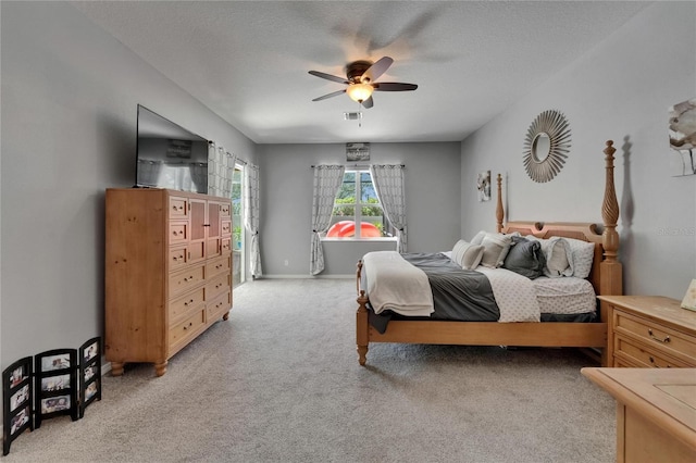 bedroom featuring carpet flooring, visible vents, and a ceiling fan