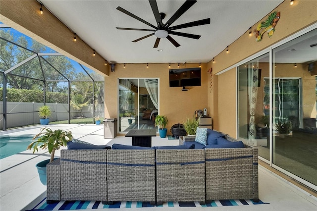 view of patio with a ceiling fan, glass enclosure, fence, an outdoor hangout area, and a fenced in pool