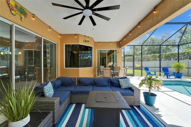 view of patio / terrace with a fenced in pool, an outdoor living space, a lanai, ceiling fan, and fence