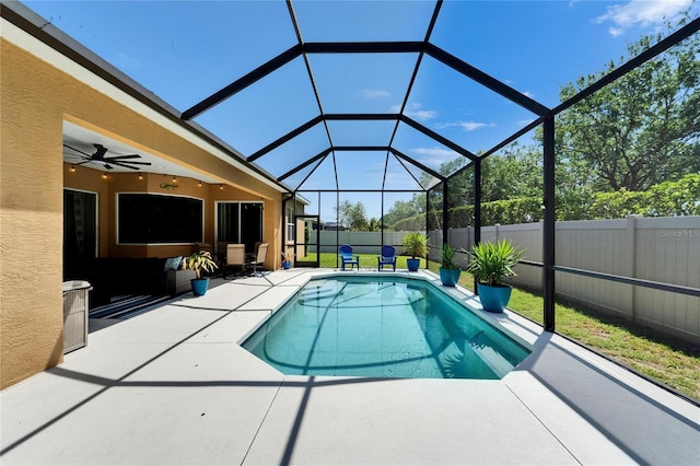 view of pool featuring a lanai, a patio, a fenced backyard, and a fenced in pool