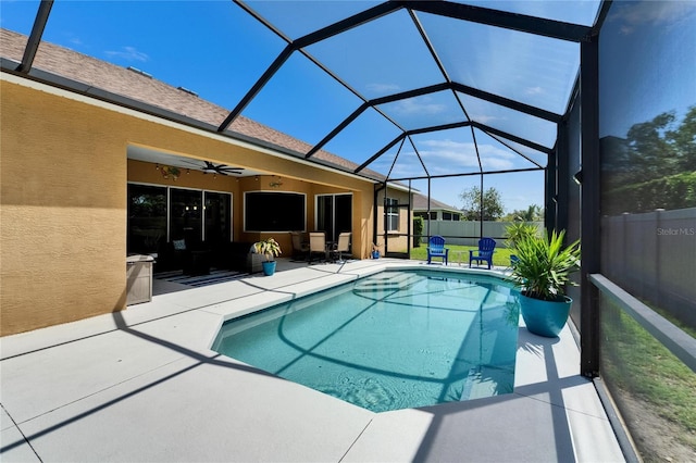 view of pool featuring ceiling fan, fence, a patio, a fenced in pool, and a lanai